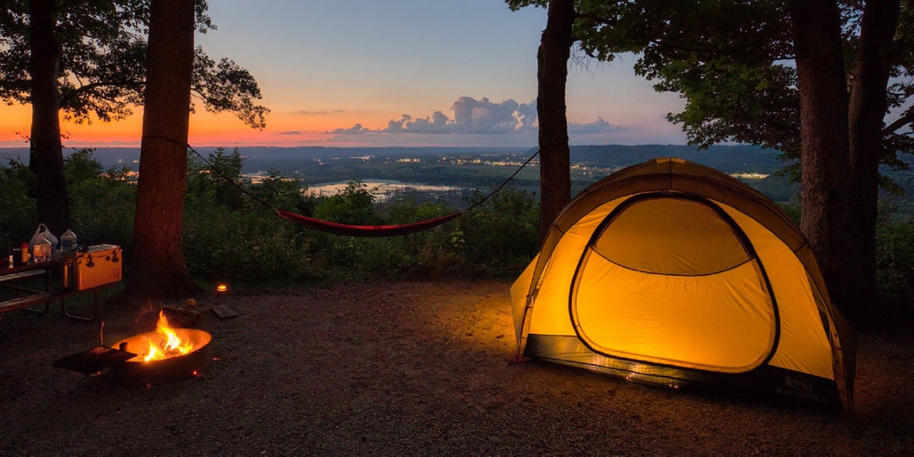 Camping with a tent in the sunset